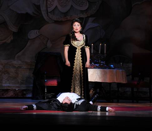 Standing: Olga Chernisheva as Tosca