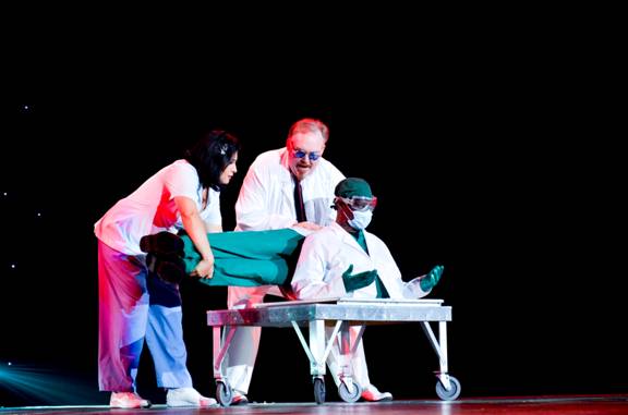 KEVIN JAMES, center shows a man who had been cut, on top of a table