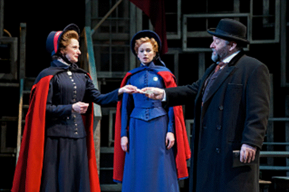 L-R JENNIFER CLEMENT as Mrs. Baines GRETCHEN HALL as Major Barbara and DEAN PAUL GIBSON as Andre Undershaft.